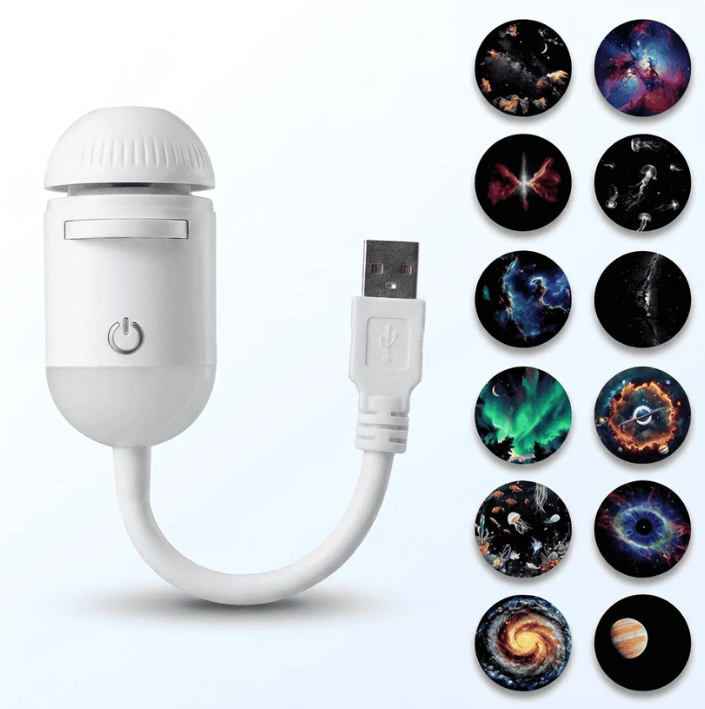 Velique Orbit galaxy projector on a bedside table in warm night light mode